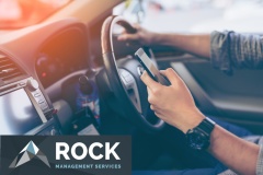 Hand's man using smartphone while driving the car