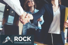 Young business people shaking hands in the office. Finishing successful meeting. Three persons