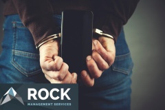man hand handcuffs and phone