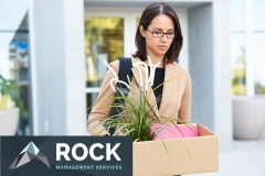 Redundant Businesswoman Leaving Office With Box